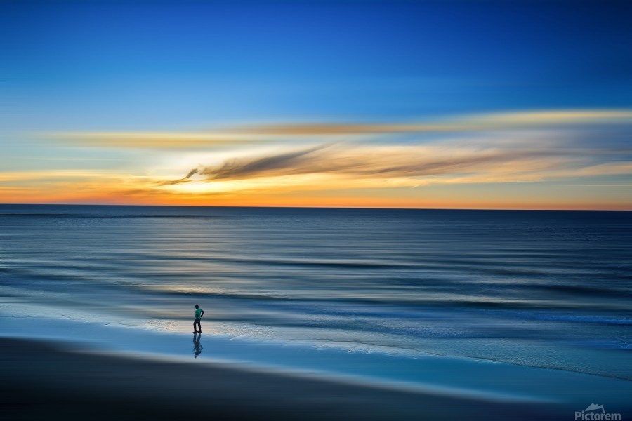 Reflective Calm. Tranquil sunset scenery at the ocean with the